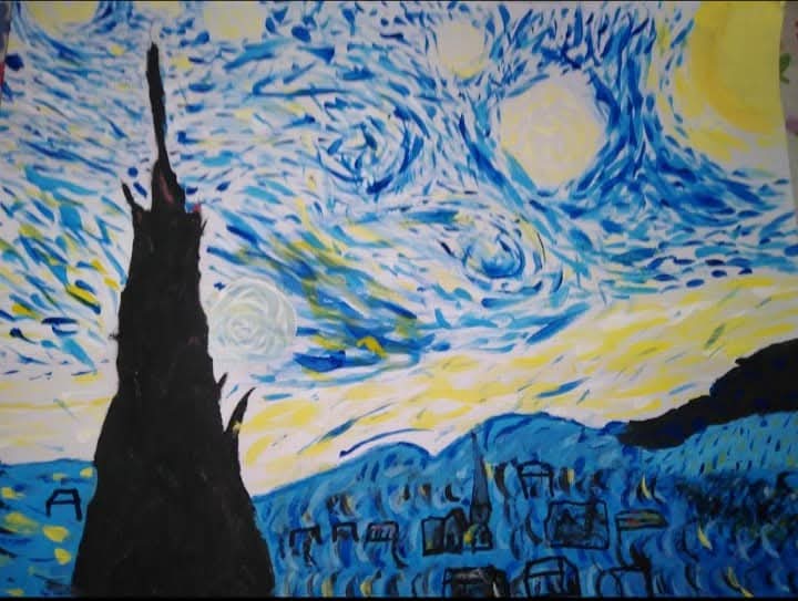 Estudiantes pintando mural